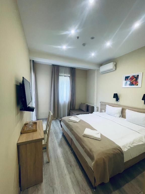 Postel nebo postele na pokoji v ubytování Hotel Brick House