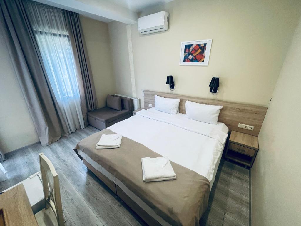 Postel nebo postele na pokoji v ubytování Hotel Brick House
