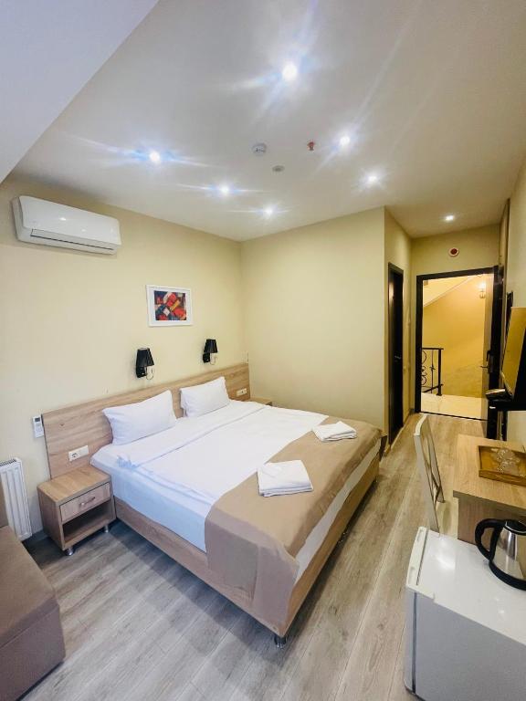 Postel nebo postele na pokoji v ubytování Hotel Brick House