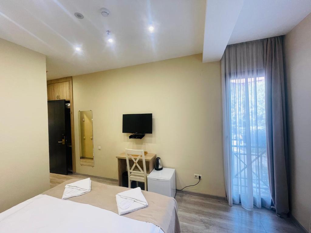 TV a/nebo společenská místnost v ubytování Hotel Brick House