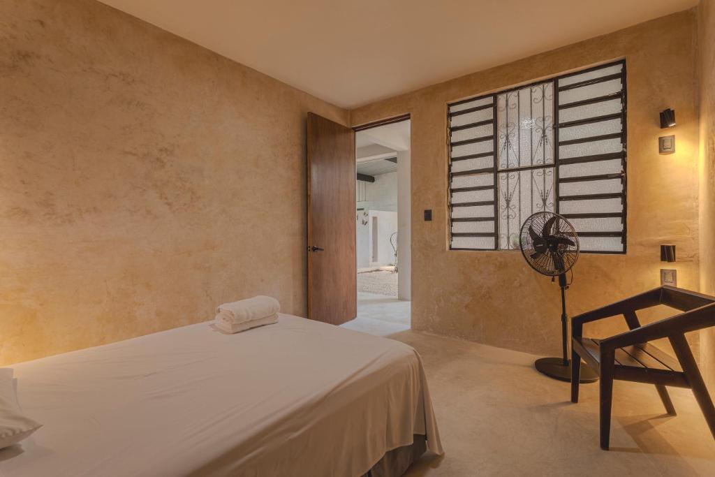 Postel nebo postele na pokoji v ubytování Hostal Yum Kin