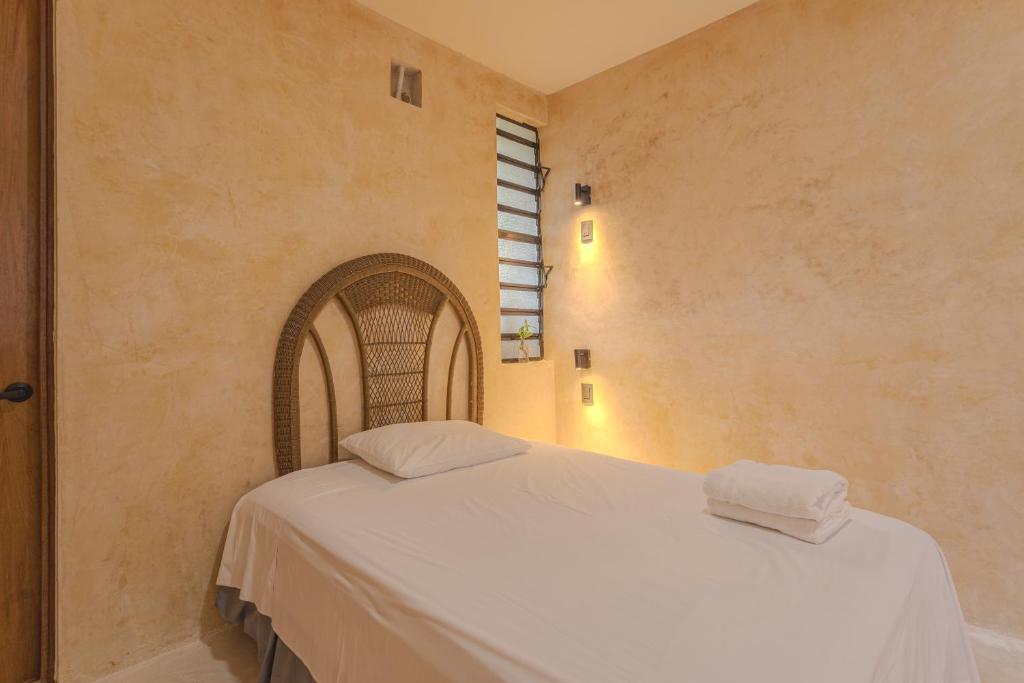 Postel nebo postele na pokoji v ubytování Hostal Yum Kin
