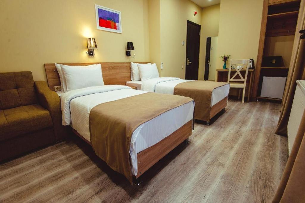 Postel nebo postele na pokoji v ubytování Hotel Brick House