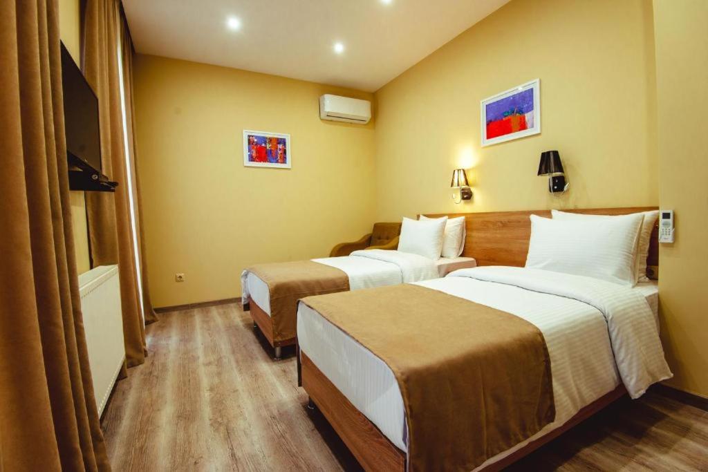 Postel nebo postele na pokoji v ubytování Hotel Brick House