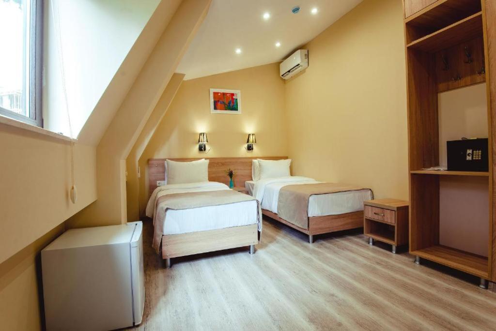 Postel nebo postele na pokoji v ubytování Hotel Brick House