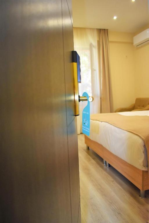 Postel nebo postele na pokoji v ubytování Hotel Brick House