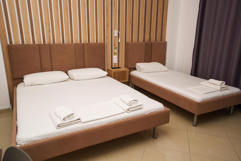 Postel nebo postele na pokoji v ubytování Hotel Piazza
