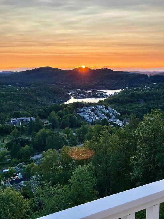 a view of a sunset from the balcony of a house at Sjåen Panorama in Kragerø