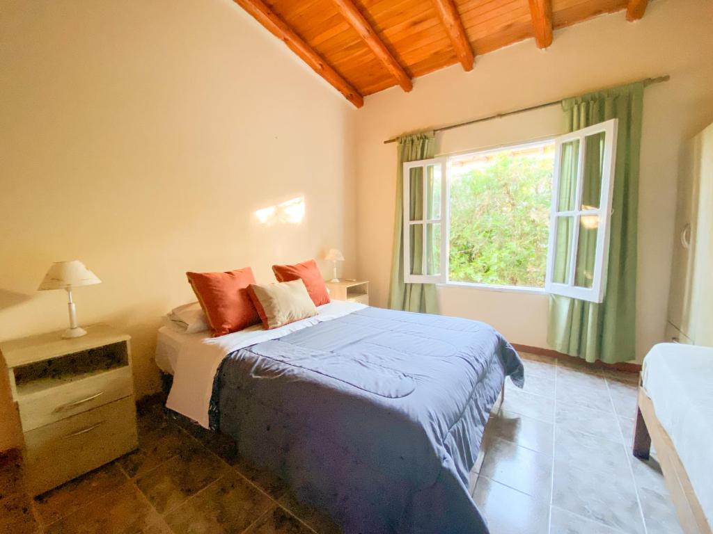 Un pat sau paturi într-o cameră la Silencio, cielo estrellado y naturaleza en Cañon del Atuel