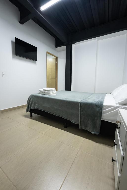 Postel nebo postele na pokoji v ubytování Apartahotel Tonchala