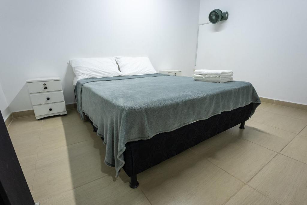 Postel nebo postele na pokoji v ubytování Apartahotel Tonchala