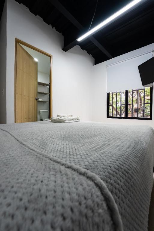 Postel nebo postele na pokoji v ubytování Apartahotel Tonchala
