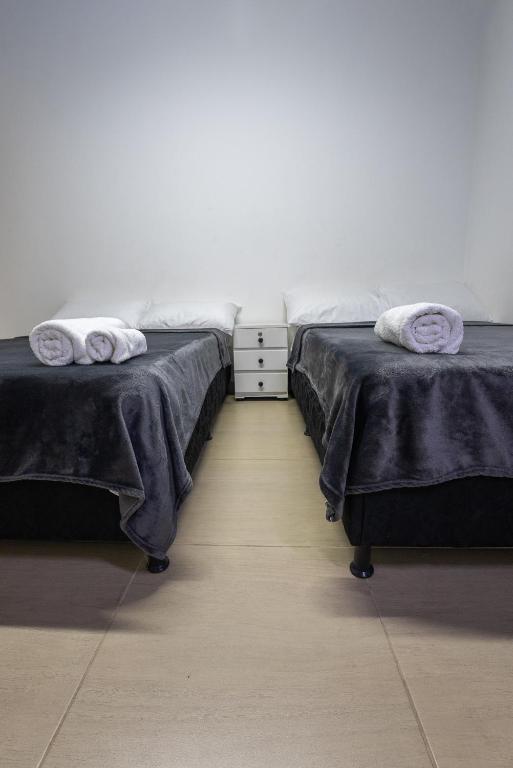 Postel nebo postele na pokoji v ubytování Apartahotel Tonchala