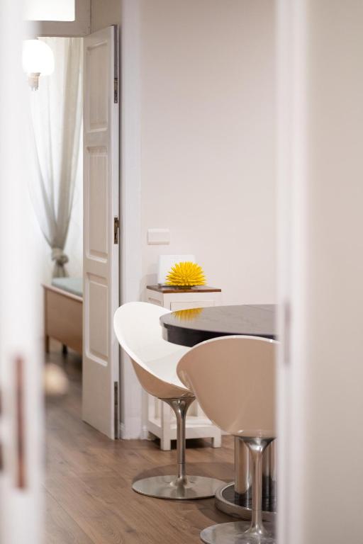 a dining room with a table and two chairs at Esperia Maison B&b in Montesarchio