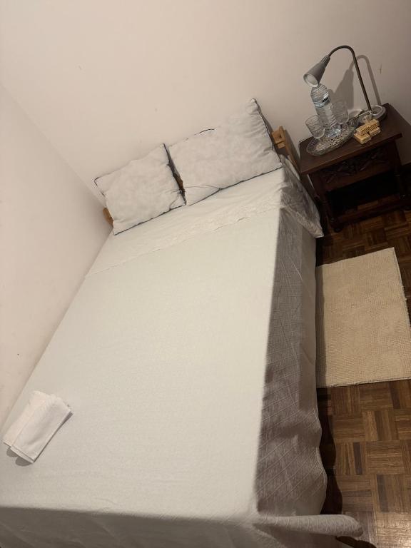 a bed that has been covered in plastic at Mk house in Estoril