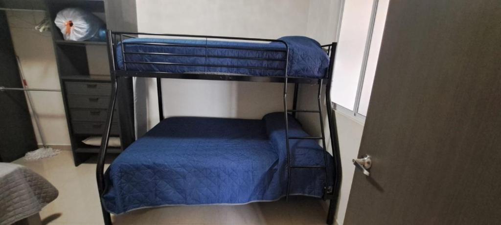 Postel nebo postele na pokoji v ubytování Tres Palmas Departamentos