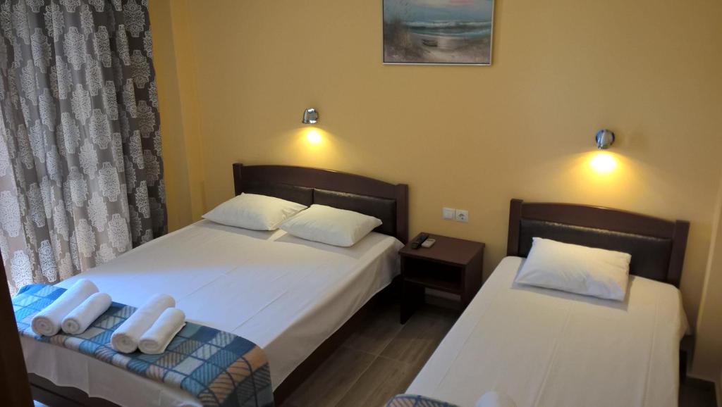 A bed or beds in a room at Apartments Palladium