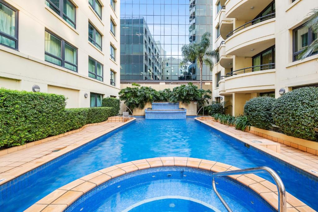 a swimming pool in the middle of a building at Bright Studio with Pool Access in Parramatta in Sydney
