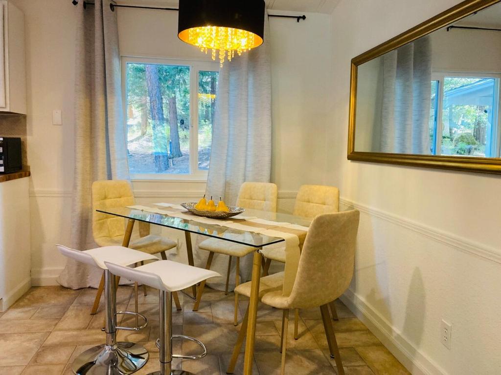 a dining room with a table and chairs and a window at Dafna, Unit 5 in Cromberg