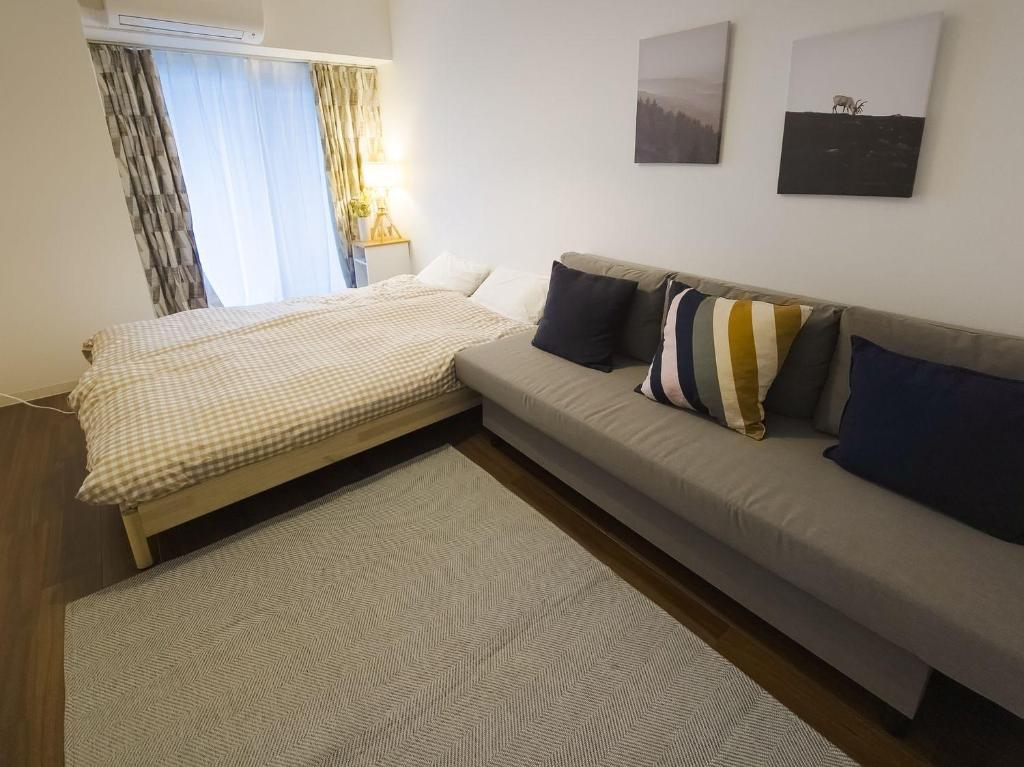 Postel nebo postele na pokoji v ubytování Suke Home Oshiage