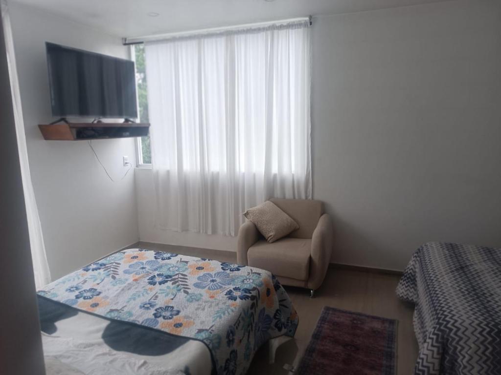 TV a/nebo společenská místnost v ubytování Casa blanca