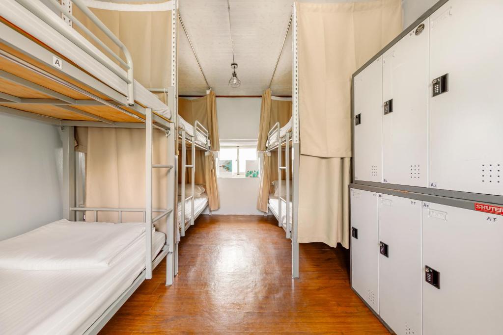 Postel nebo postele na pokoji v ubytování 琉意旅宿