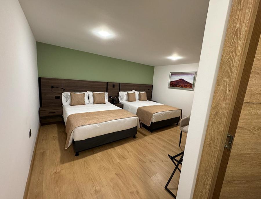 Postel nebo postele na pokoji v ubytování Entrenevados Hotel