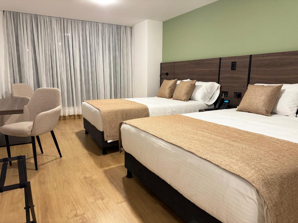 Postel nebo postele na pokoji v ubytování Entrenevados Hotel