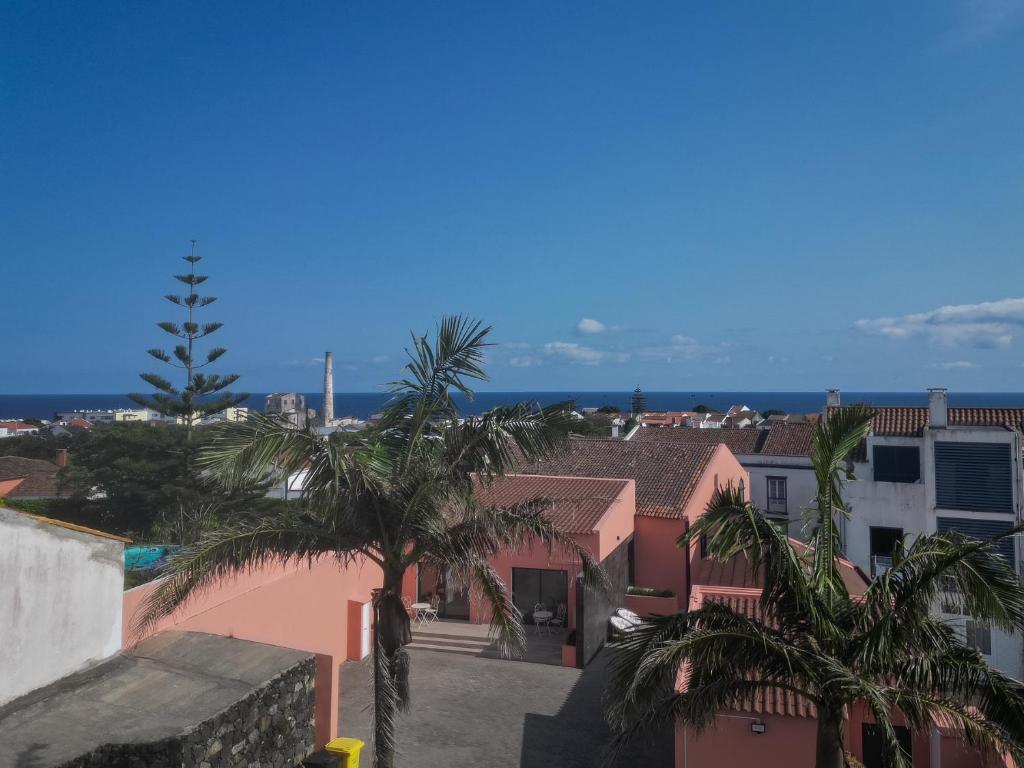 a view from the roof of a building with palm trees at Quinta do Rosário in Lagoa