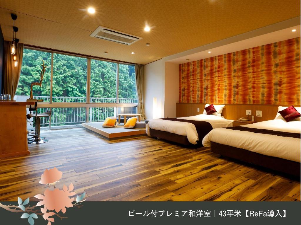Letto o letti in una camera di Hinotani Onsen Misugi Resort