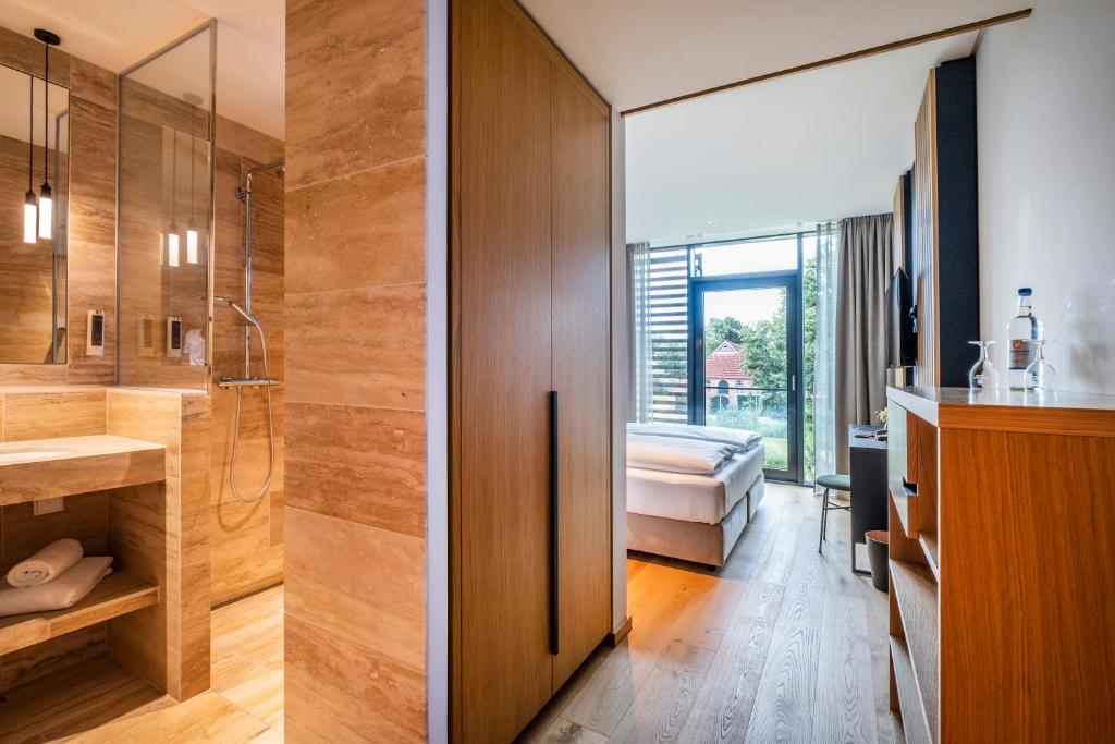 Postel nebo postele na pokoji v ubytování Hotel Breitenburg