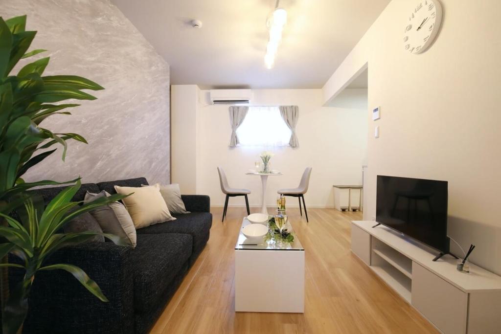 TV a/nebo společenská místnost v ubytování フォルモント寺田町 203