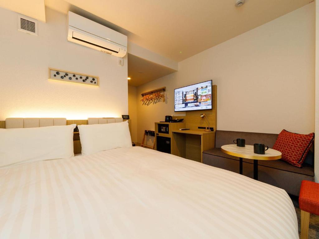 Postel nebo postele na pokoji v ubytování Comfort Hotel Kii Tanabe