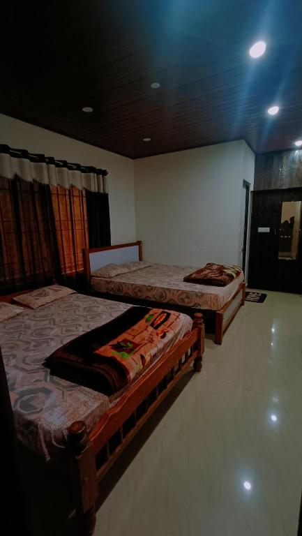 Postel nebo postele na pokoji v ubytování New Hambala Homestay