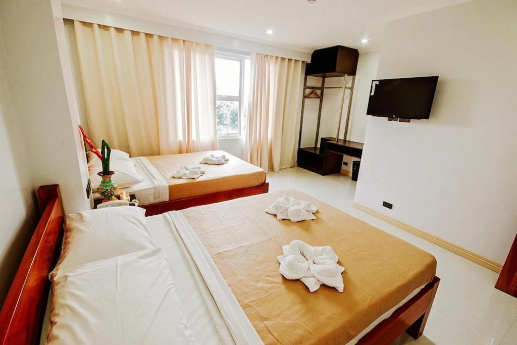 Postel nebo postele na pokoji v ubytování Hotel Lapira Vigan