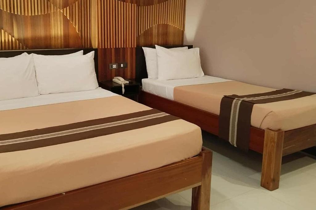 Postel nebo postele na pokoji v ubytování Hotel Lapira Vigan