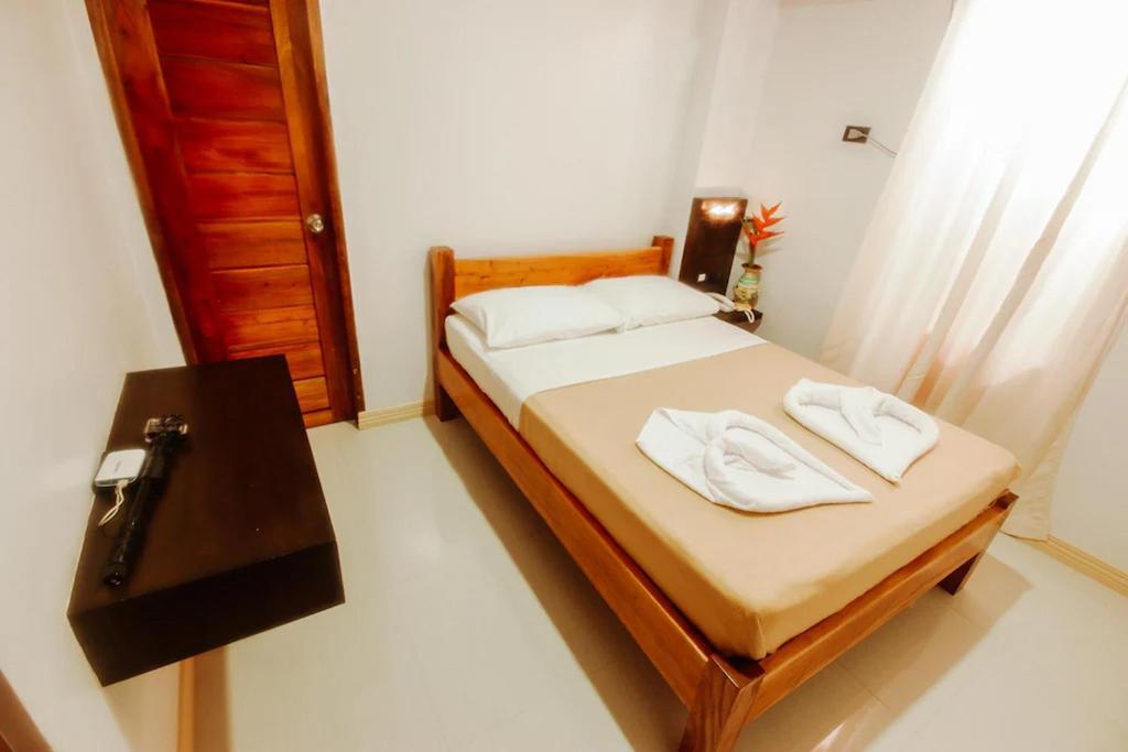 Postel nebo postele na pokoji v ubytování Hotel Lapira Vigan