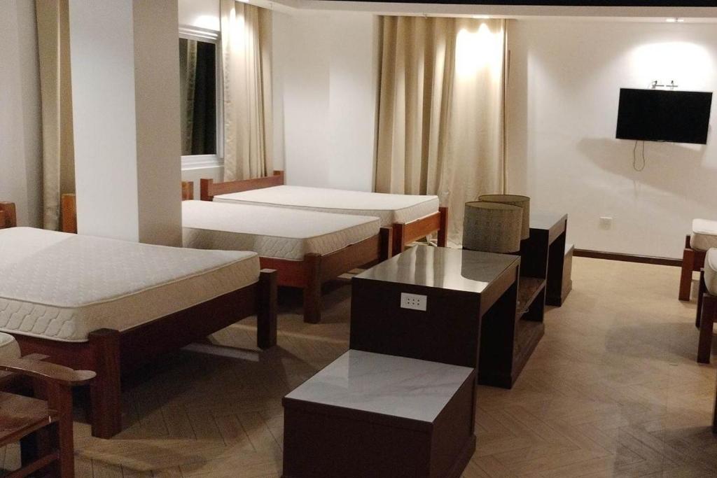 Postel nebo postele na pokoji v ubytování Hotel Lapira Vigan