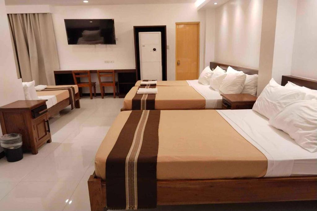 Postel nebo postele na pokoji v ubytování Hotel Lapira Vigan