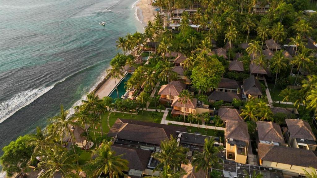 an aerial view of a resort next to the ocean at Qunci Villas Resort in Senggigi