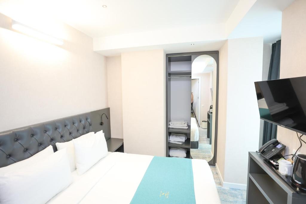 Postel nebo postele na pokoji v ubytování Hotel MTbilisi