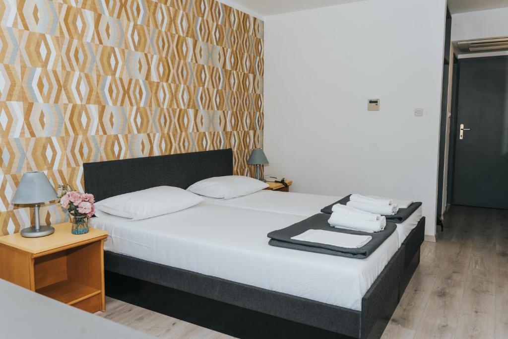 Postel nebo postele na pokoji v ubytování Hotel Tolero