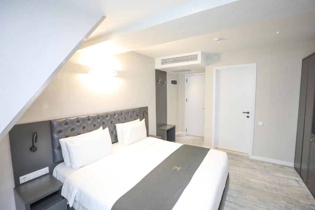 Postel nebo postele na pokoji v ubytování Hotel MTbilisi