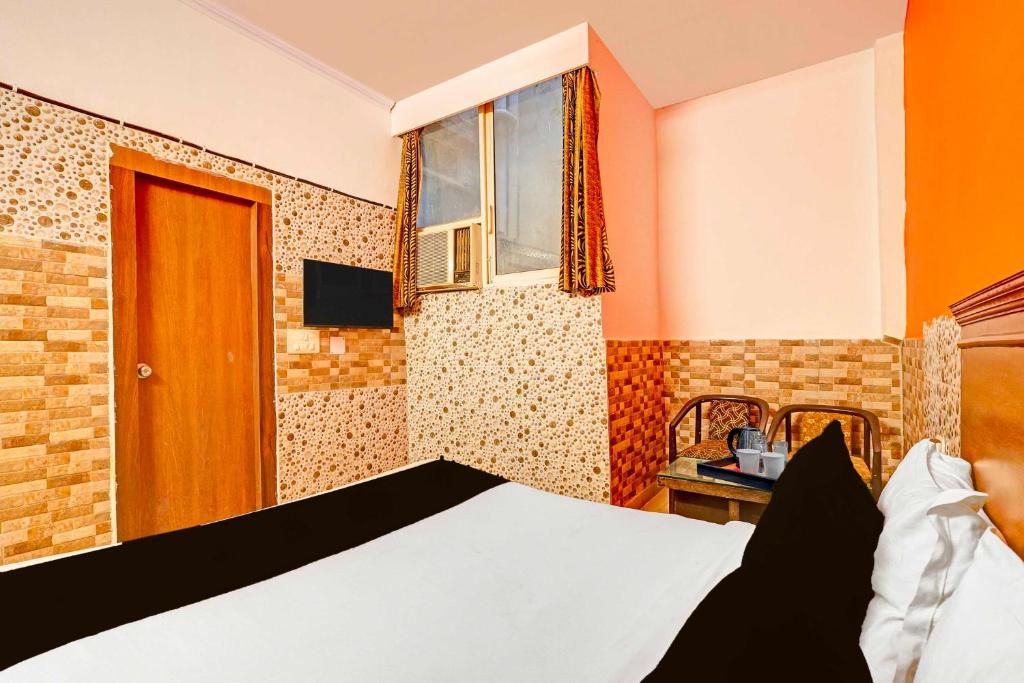 Postel nebo postele na pokoji v ubytování Collection O Kanode Gate