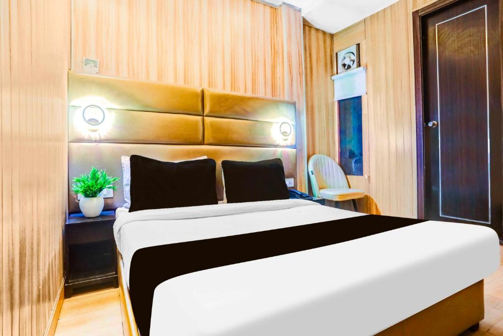 Ένα ή περισσότερα κρεβάτια σε δωμάτιο στο Collection O Prayagraj Rambag Railway Station