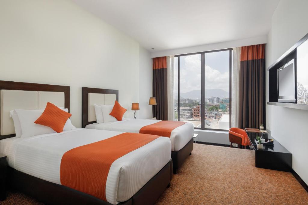 Postel nebo postele na pokoji v ubytování Hotel Himalaya