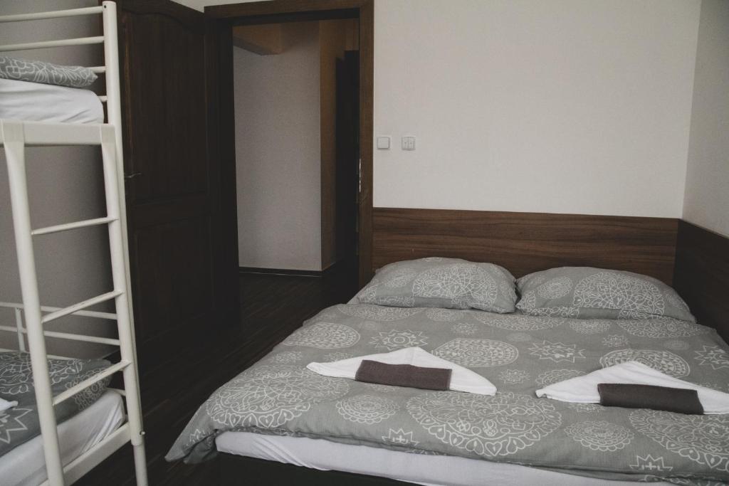 Postel nebo postele na pokoji v ubytování Apartmán Pasohlávky - rodinný komfort se dvěma ložnicemi a kuchyní