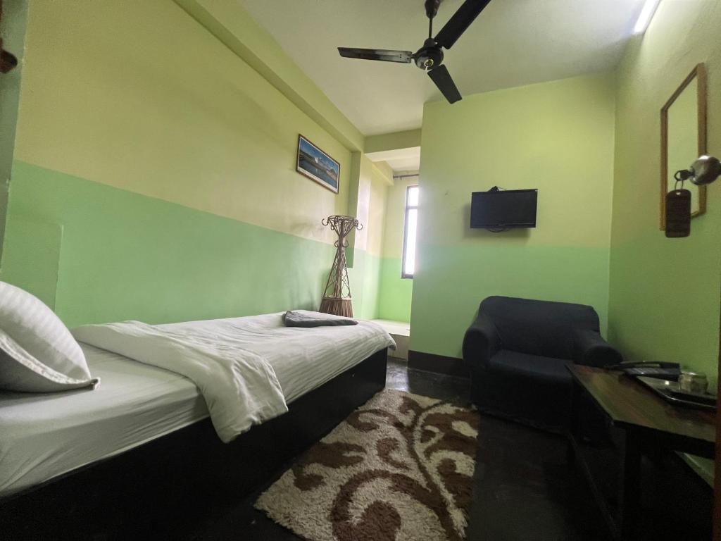 Postel nebo postele na pokoji v ubytování Metro Eco Hotel