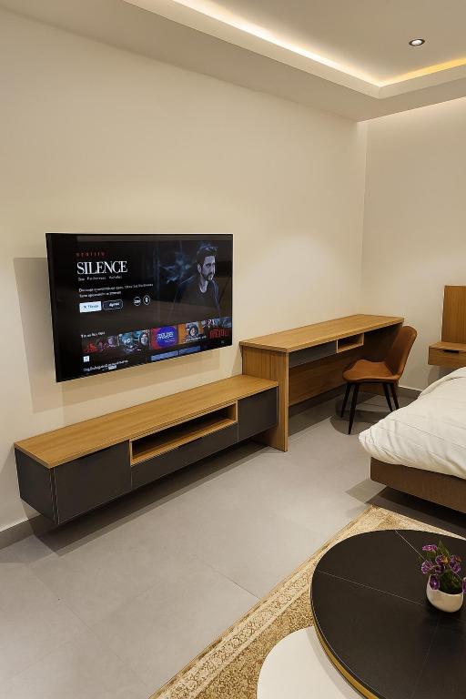 TV a/nebo společenská místnost v ubytování Arusha by 203 by SPL