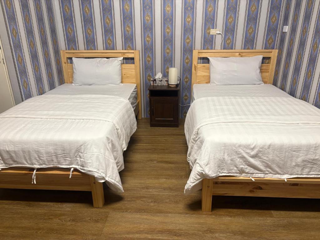 Postel nebo postele na pokoji v ubytování 水源棧